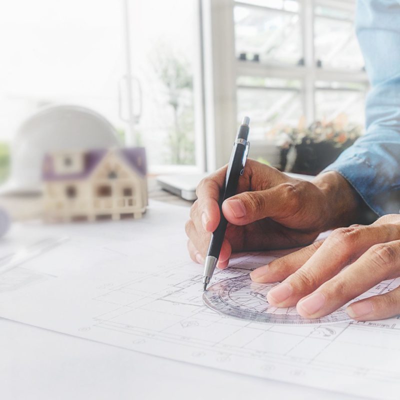 hands-engineer-working-blueprint-construction-concept-engineering-tools-vintage-tone-retro-filter-effect-soft-focus-selective-focus (1)